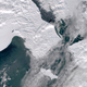 A satellite photo provided by the University of Alaska Fairbanks’ Geographic Information Network of Alaska shows clouds partially covering open water in the northern Bering Sea, the Bering Strait and the Chukchi Sea on March 4, 2019